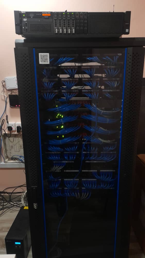 Floor-standing network cabinet with switches and a router